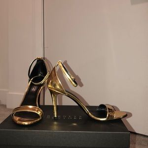 Barney’s New York gold ankle-strap heels